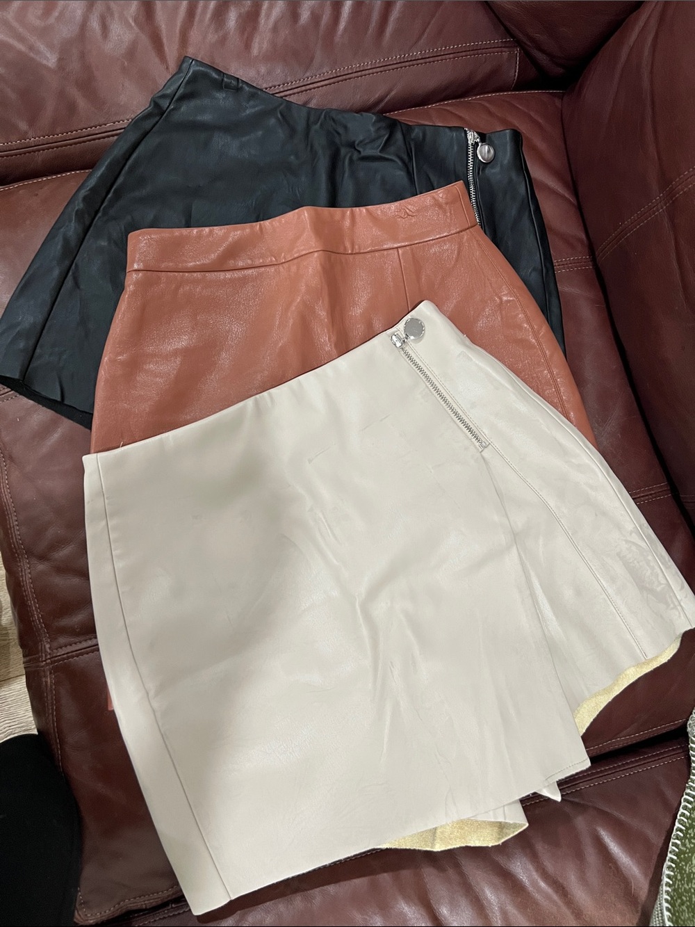 Aritzia and Zara leather skirts